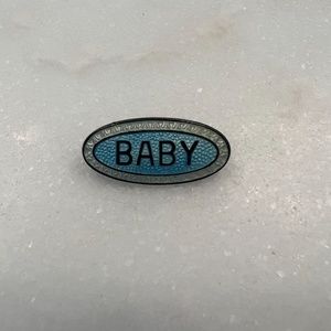 Vintage pin that says Baby